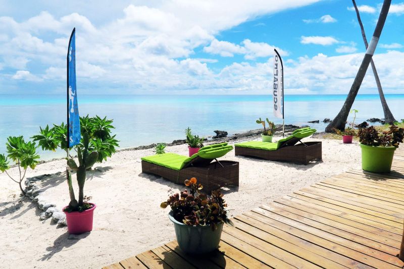The terrace and deckchairs facing the lagoon