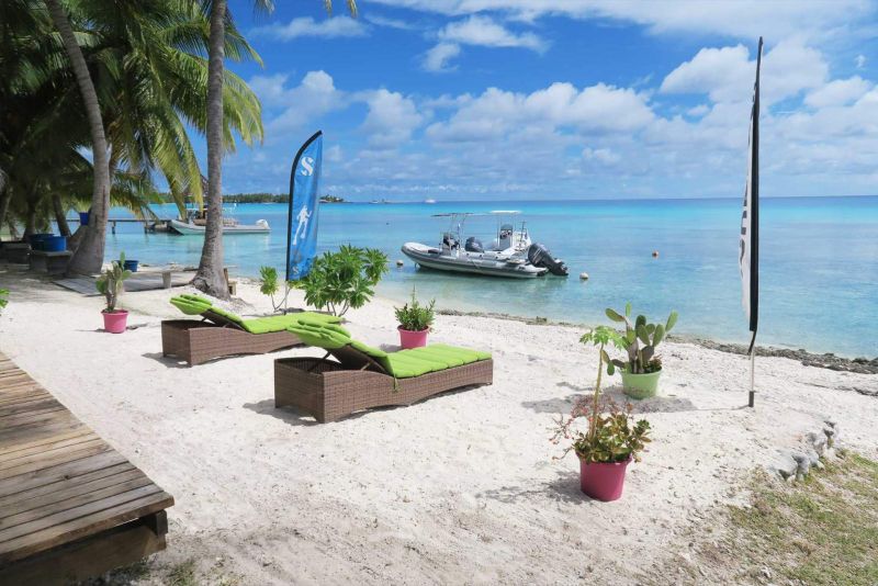 The center's beach and a boat at anchor